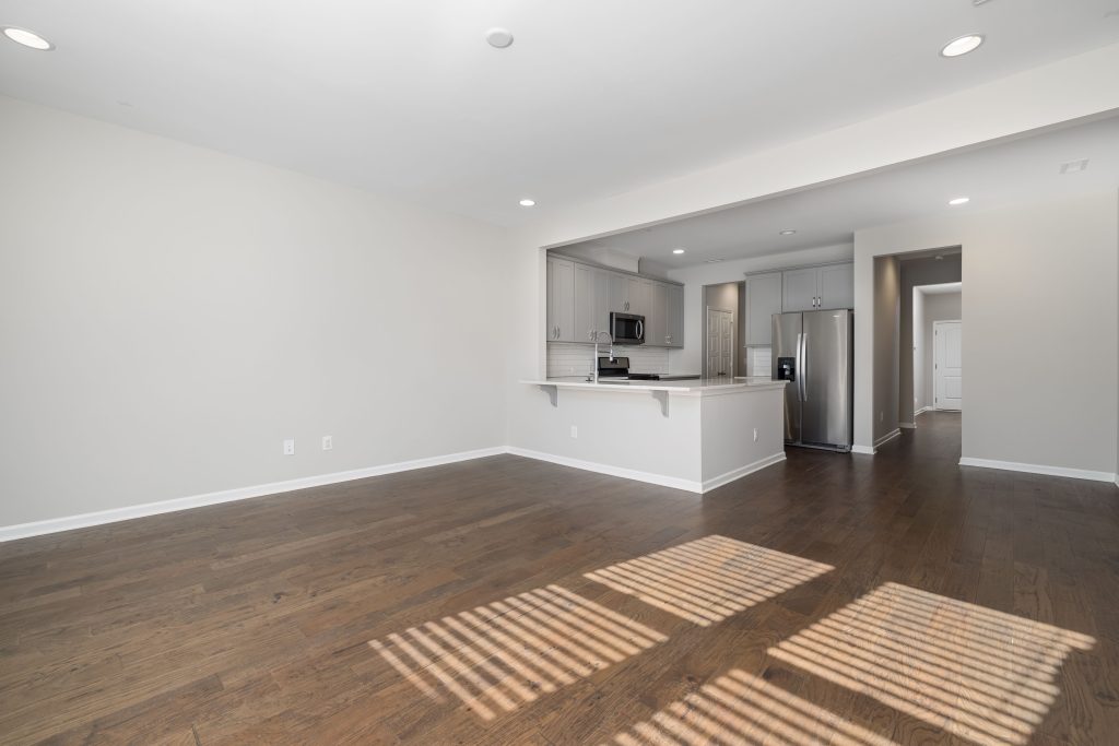 Freshly renovated open-plan kitchen and living space demonstrating property value-add and layout optimization.